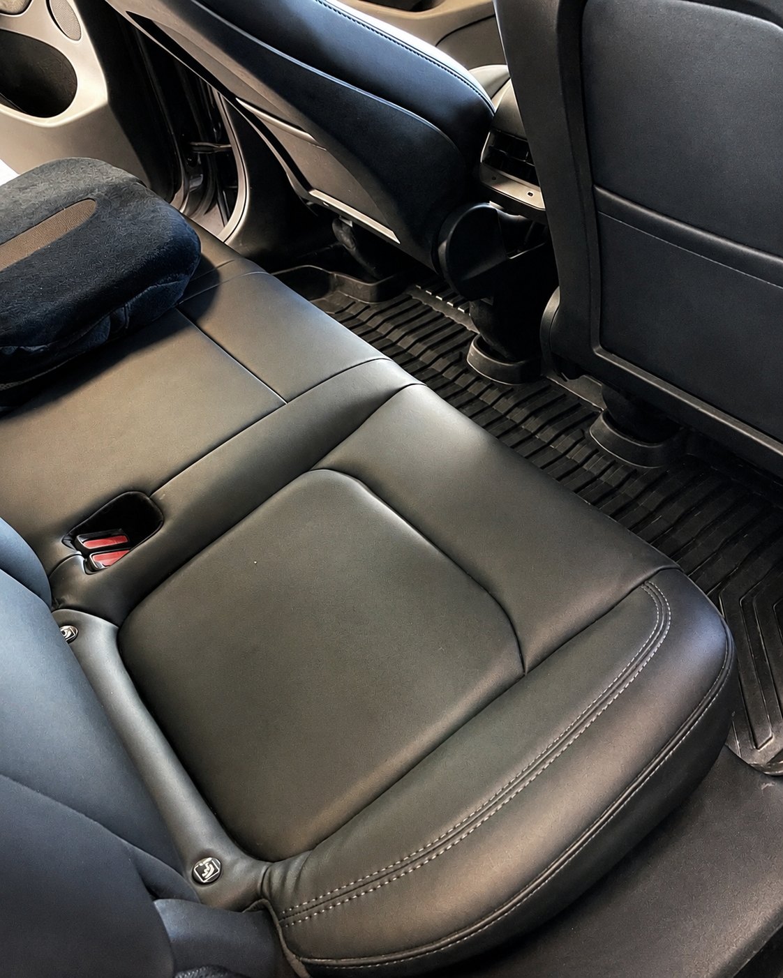 After photo of a cleaned rear passenger area in a Tesla